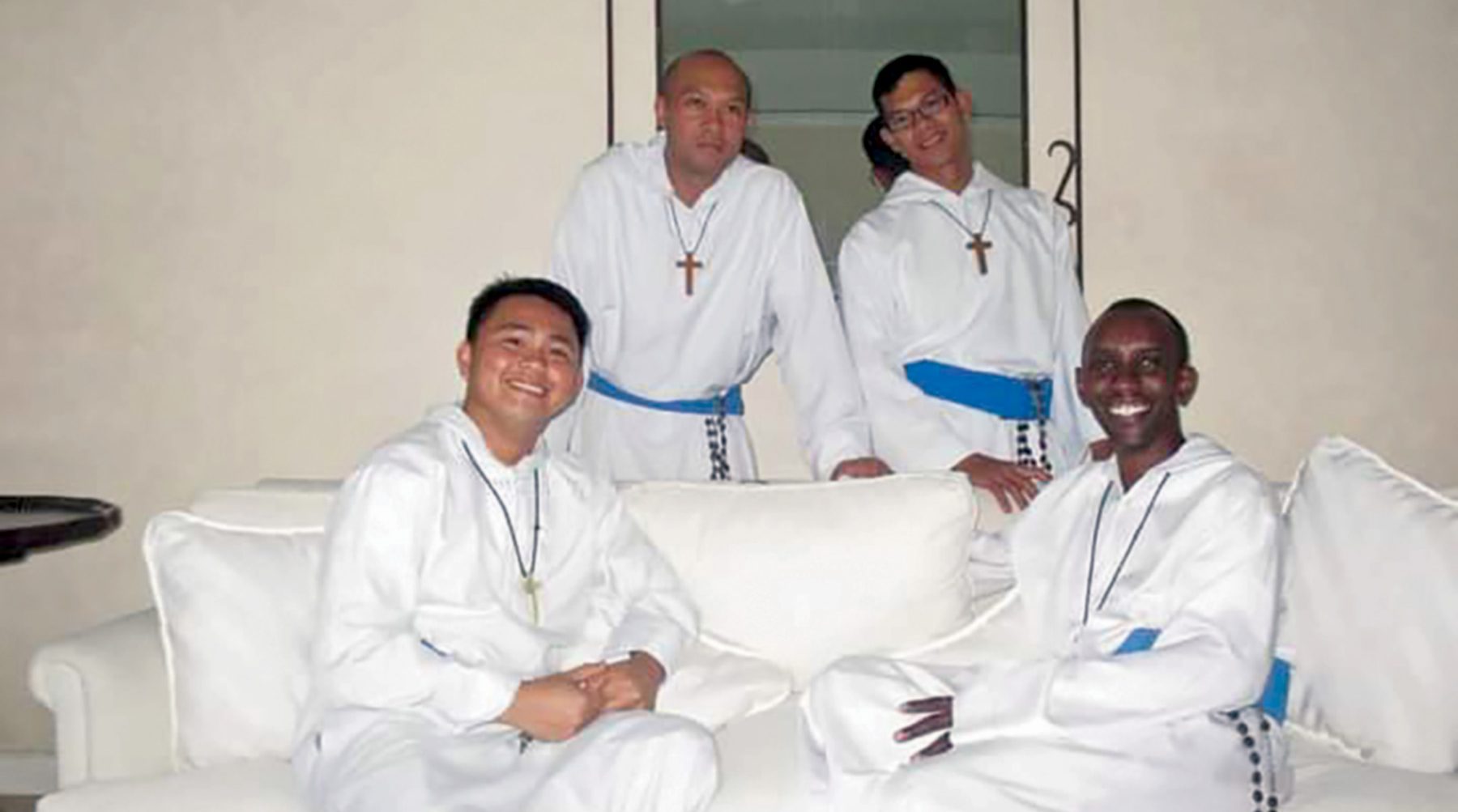 Back row, left, Fr. John Funtanares, MOP, MA '09