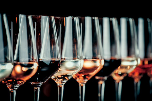 Close-up of wine glasses with various wines in them.