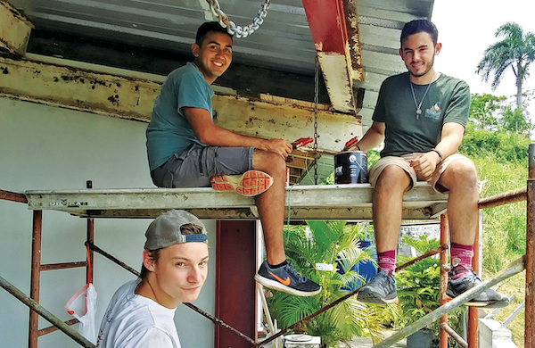 As a defense against future hurricanes, students on the Puerto Rico mission trip applied special paint and sealants to a rectory and church run by the Franciscan Friars of the Atonement.