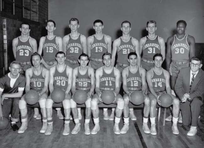 Black and white photo of the Franciscan basketball team.