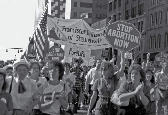 Protestors march through the streets against abortion.