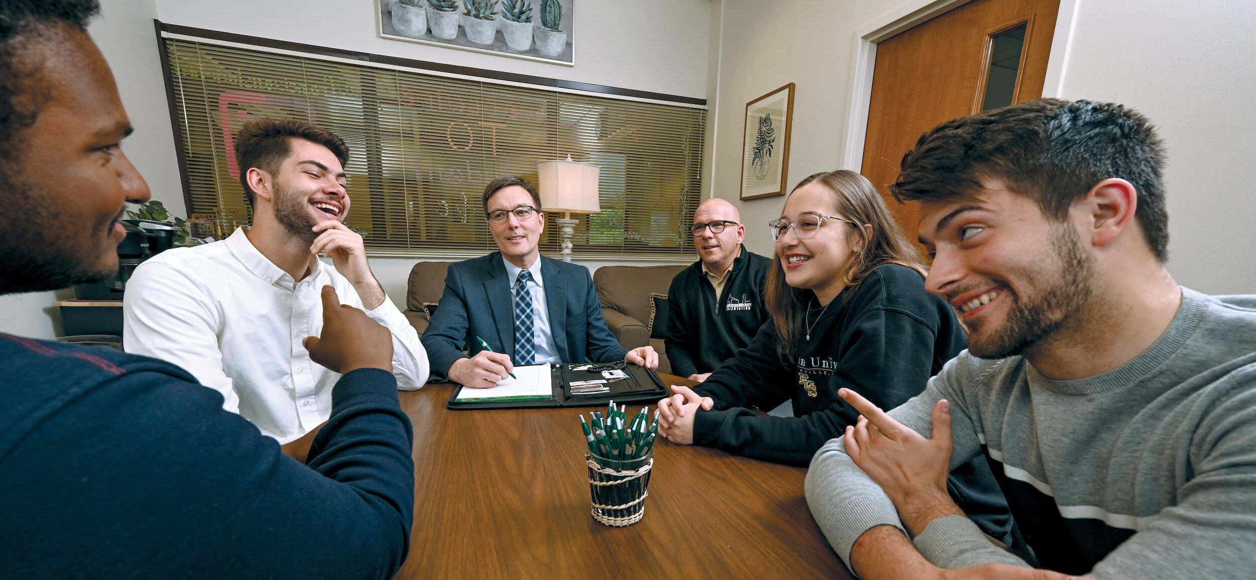 David Schmiesing ’92 MSE ’00, dean for Personal Vocation, and Dr. Dan Dentino ’97, vice president of Student Life, with outgoing and incoming student government officers Jared Johnson, Gabe Denley, Celine Najm, and Caleb Rider.