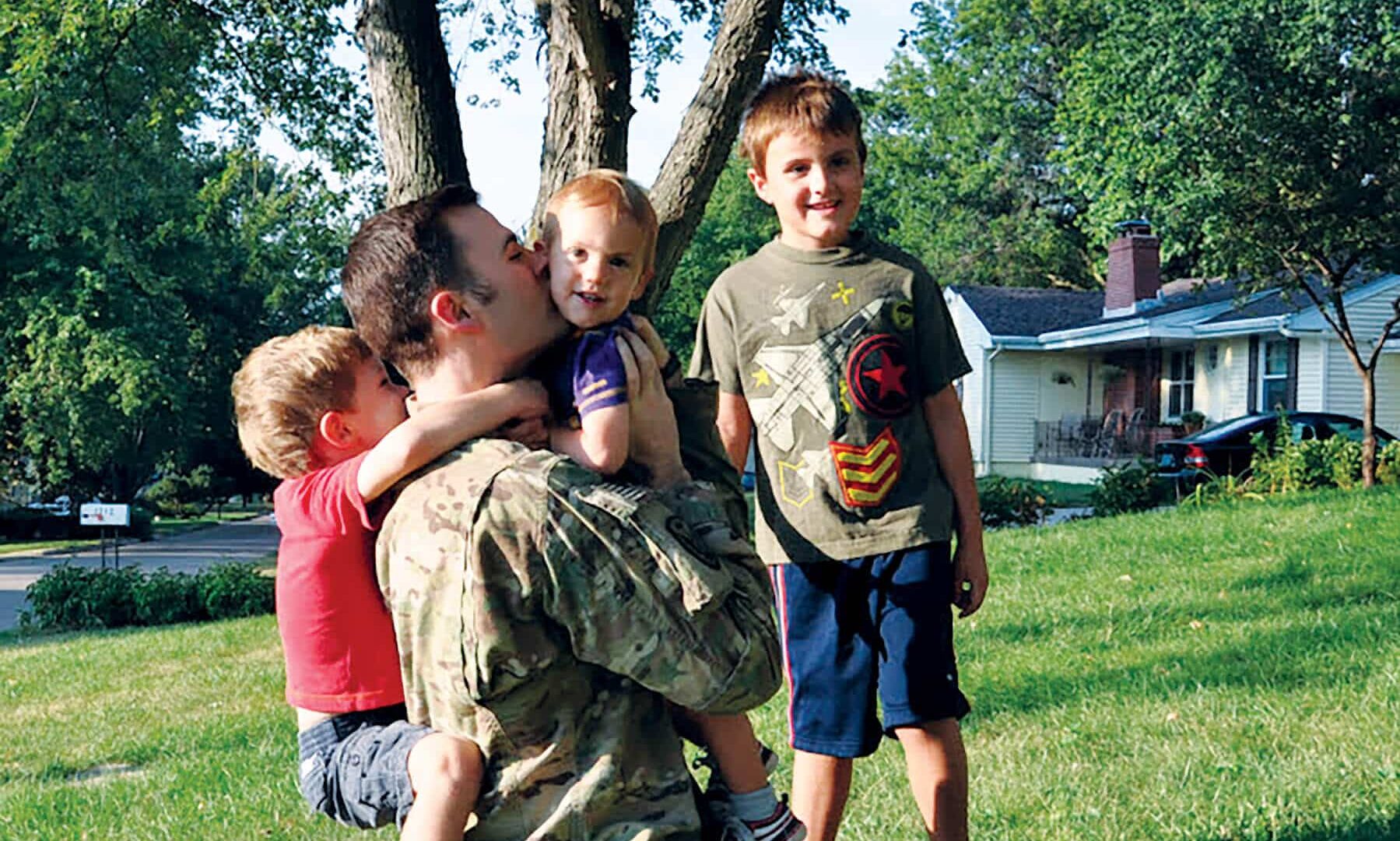 Army veteran Andrew Armstrong ’02 and his welcome committee