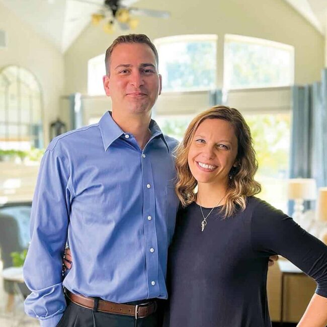 Mark and Katie Hartfiel standing in a living room.