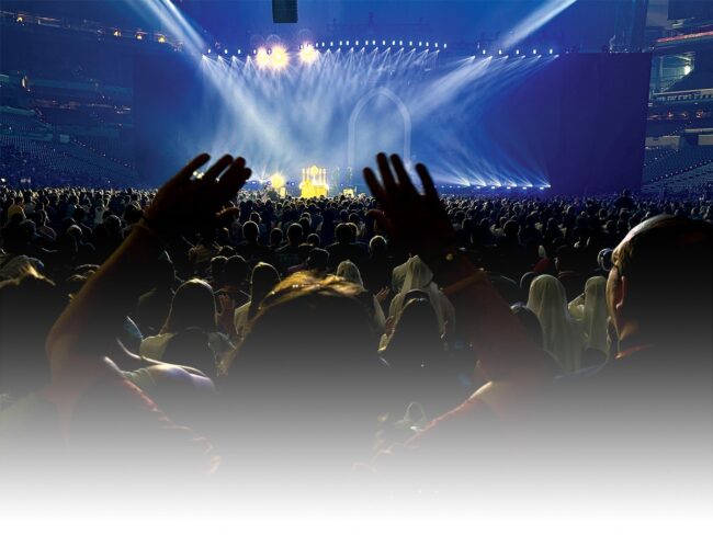 A large crowd in a concert hall at the National Eucharistic Congress.