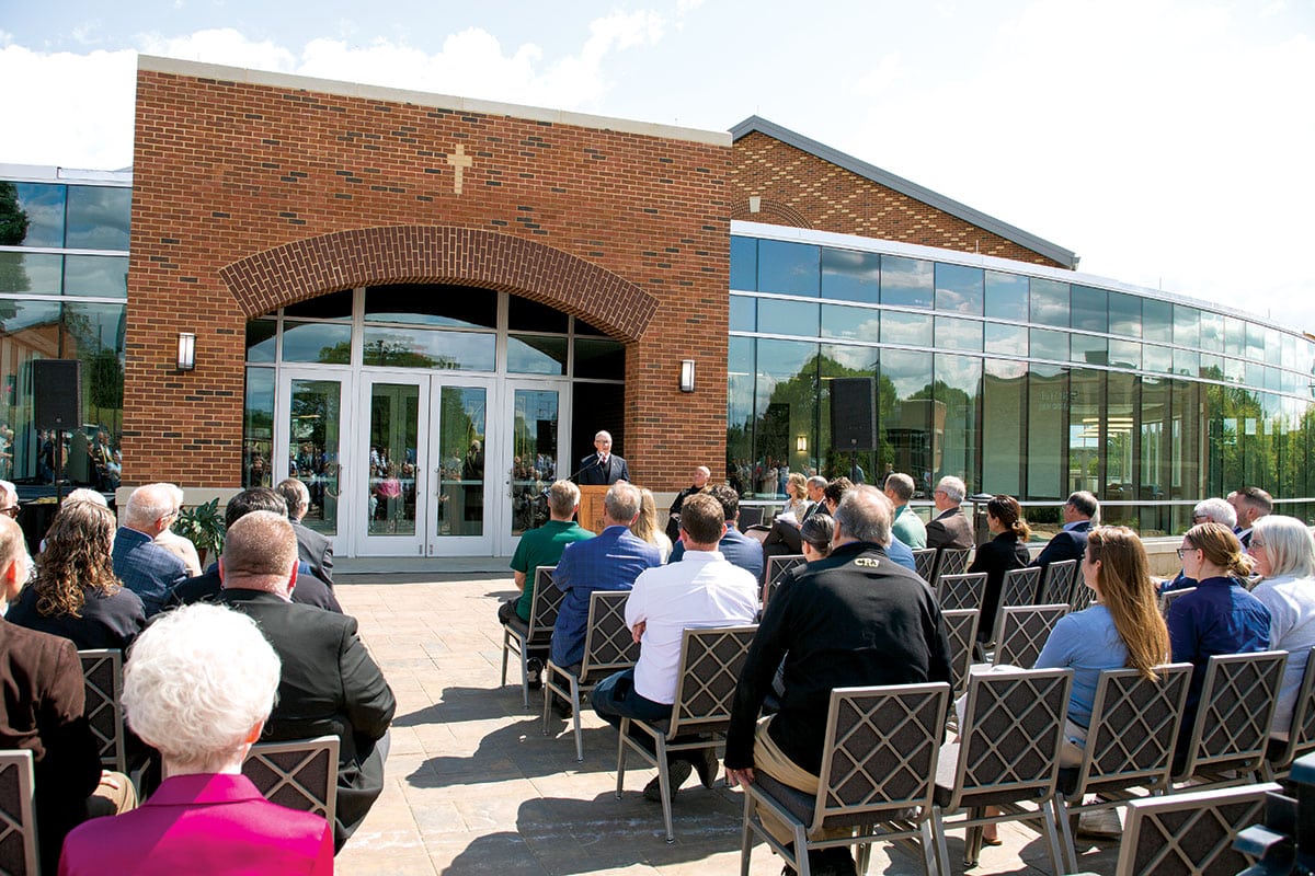 Mickey Pohl addresses the assembly before the ribbon-cutting ceremony.