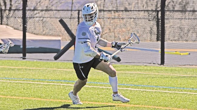 Joseph James playing lacrosse.