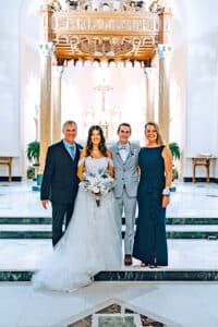 Heather and Gordon ’92 Kuhlman with Nathaniel ’22 and Mariana ’23 Kuhlman on their wedding day.