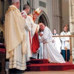 Michael Deem being blessed by the bishop at his diaconate ordination.