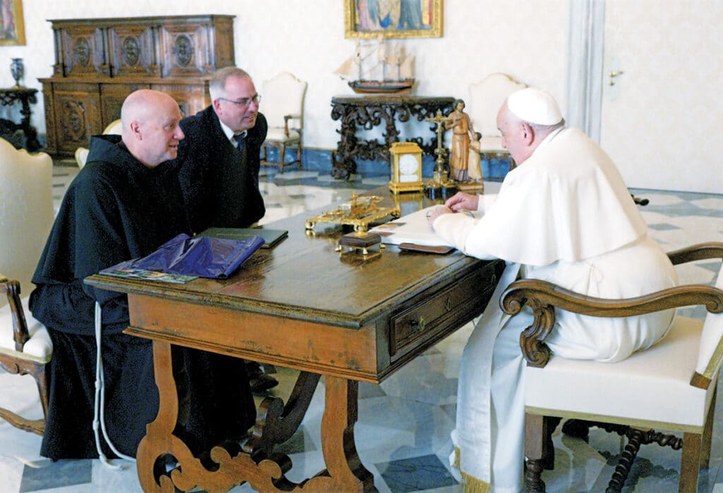 Dr. Stephen Hildebrand and Fr. Dave Pivonka sitting across from Pope Francis in December 2024.