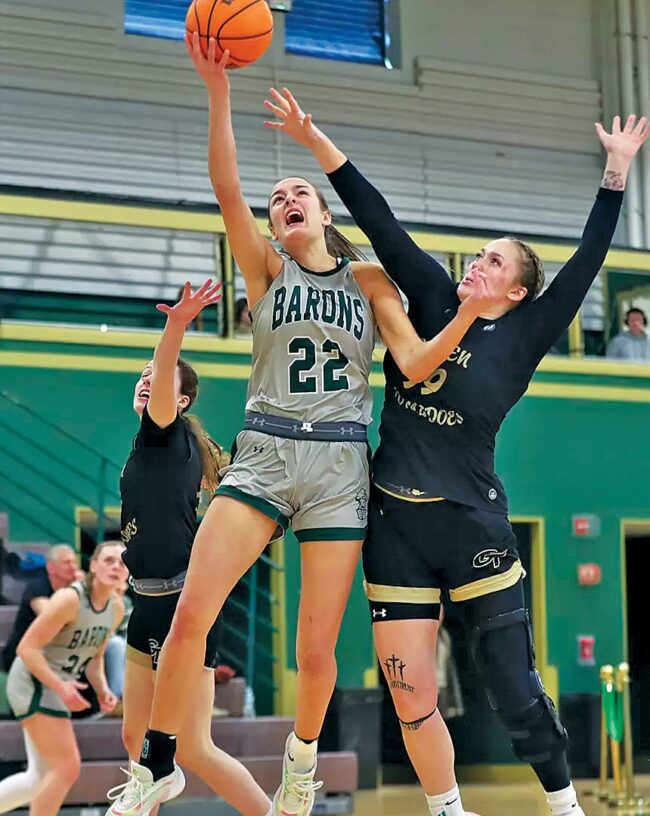 Maria McCallen during Baron's basketball game going up for a layup.