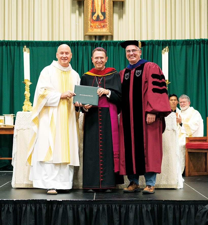 President Fr. Dave Pivonka, TOR; honorary degree recipient Bishop Andrew Cozzens; and Vice President for Academic Affairs Dr. Stephen Hildebrand
