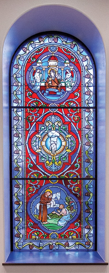 Stained-glass windows depicting St. Clare of Assisi.