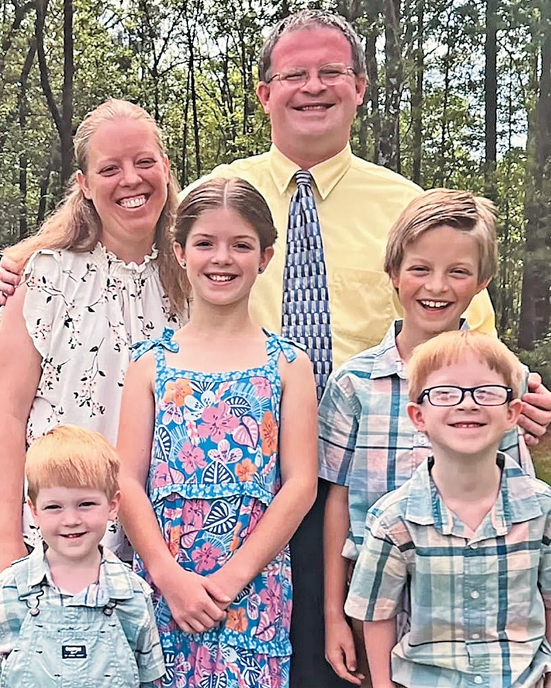 The late William “Will” Pressley Durst IV ’03 with his family