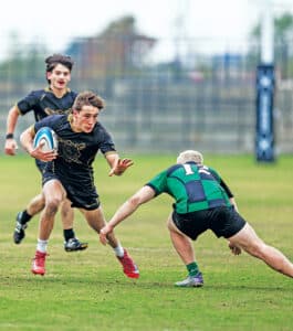 Freshman Lex Lang avoids a Slippery Rock defender to gain valuable yardage in the championship.