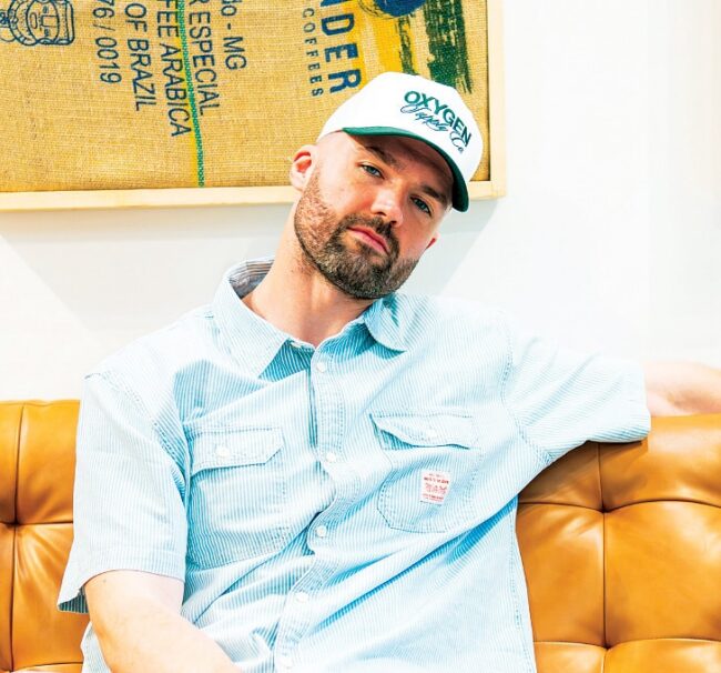 Casual headshot of Connor Flanagan sitting on a couch.