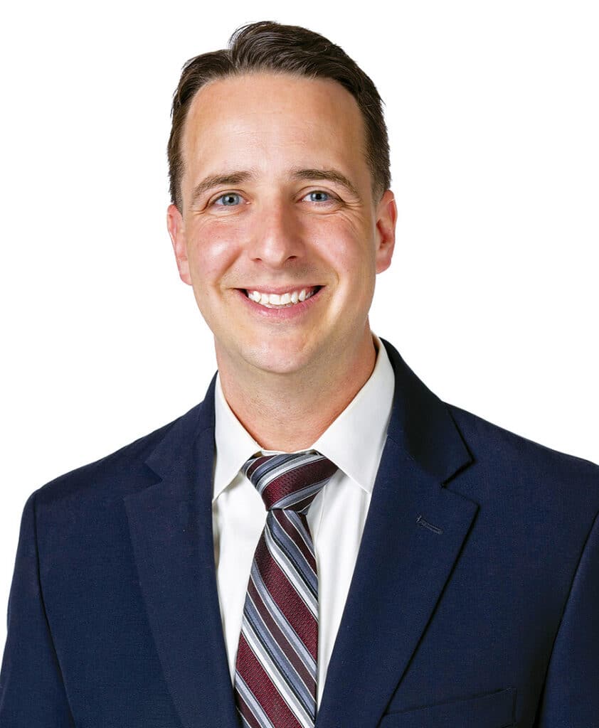 Headshot of James Kresta wearing a suit.