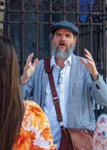 Professor Carl Fougerousse teaching students outside Notre-Dame de Chartres Cathedral.