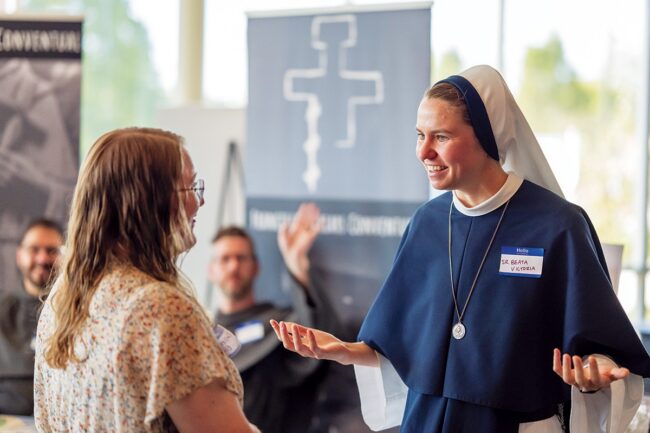 Sr. Beata Victoria Loughheed speaking with attendees at a Catholic event.