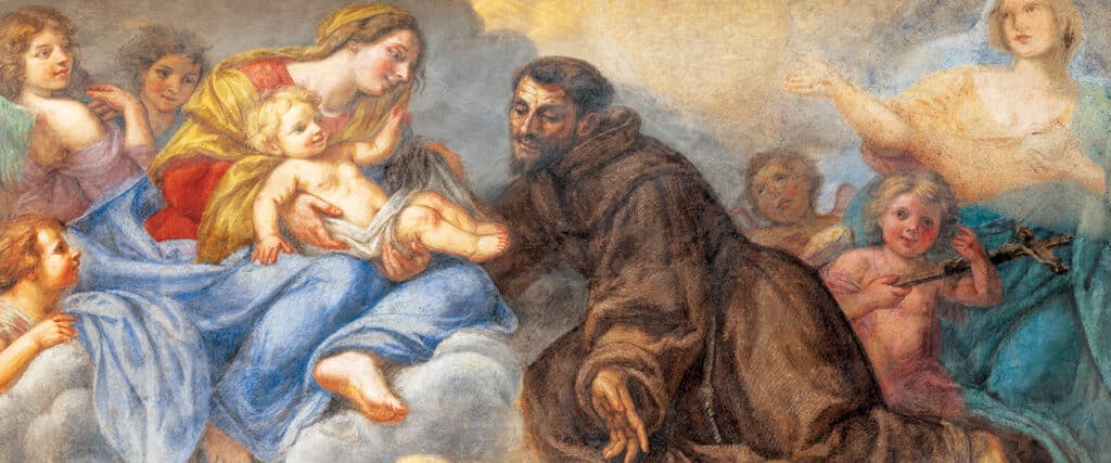 Fresco painting of Saint Francis of Assisi kneeling before the Madonna and Child surrounded by angels.